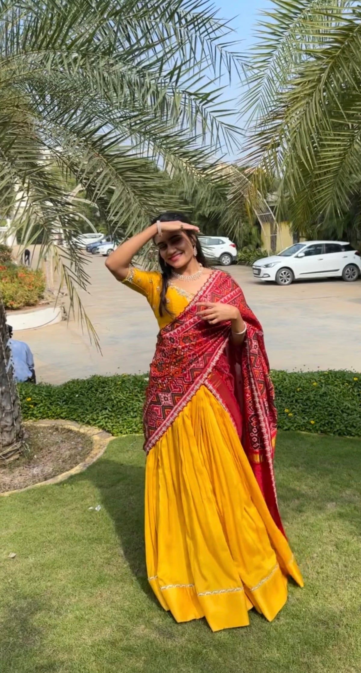 Elegant yellow Raw Silk Lehenga with  maroon Ikkat Patan Patola Dupatta and Maggam Blouse