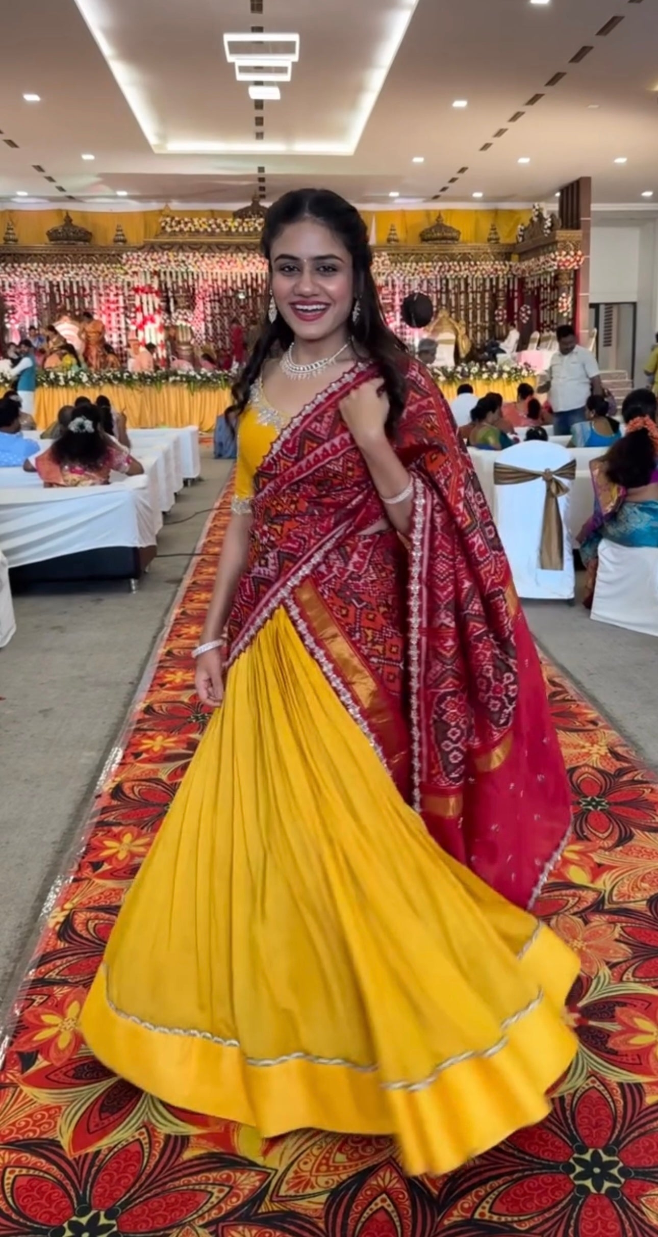 Elegant yellow Raw Silk Lehenga with  maroon Ikkat Patan Patola Dupatta and Maggam Blouse